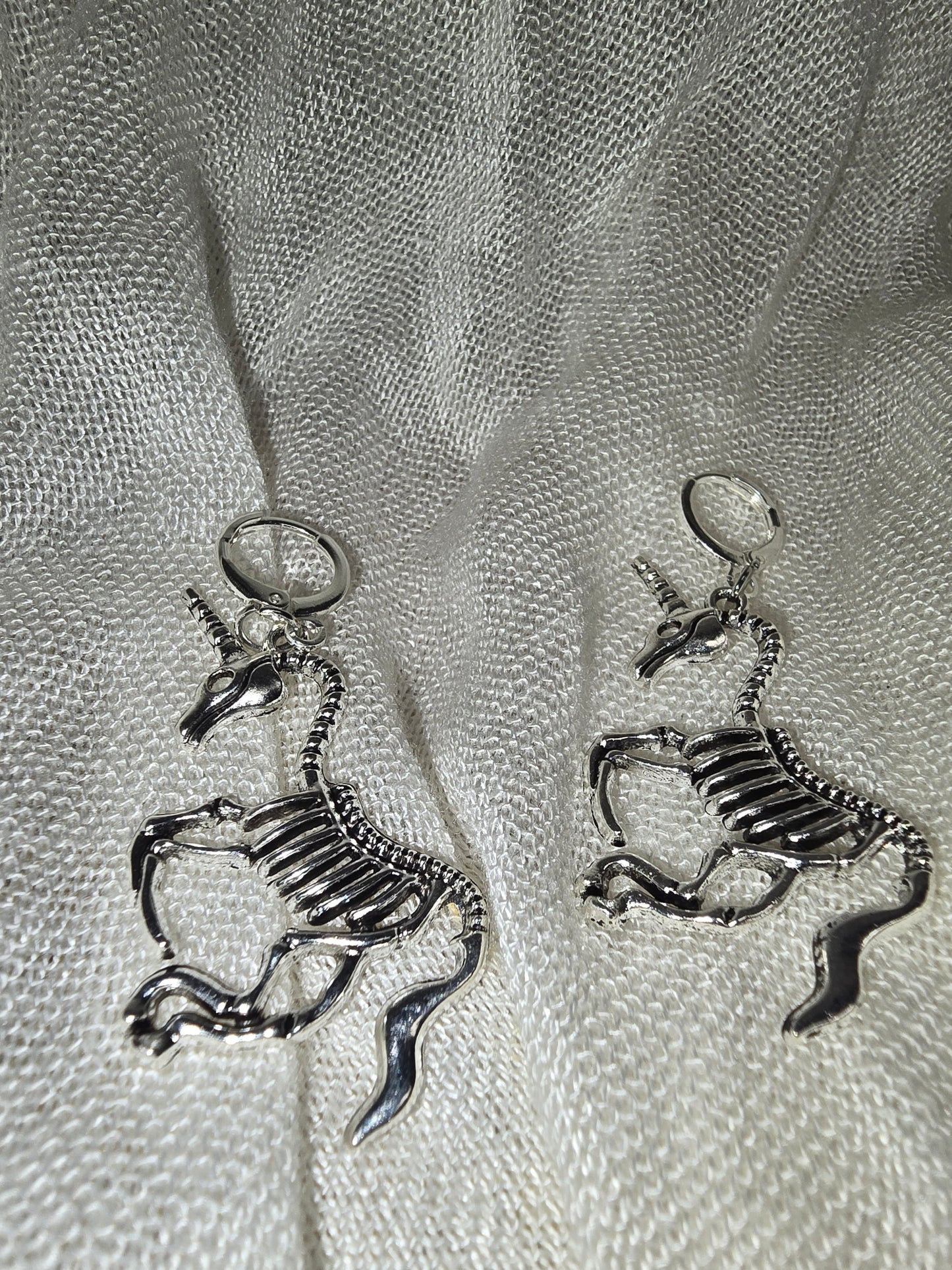 Unicorn skeleton earrings