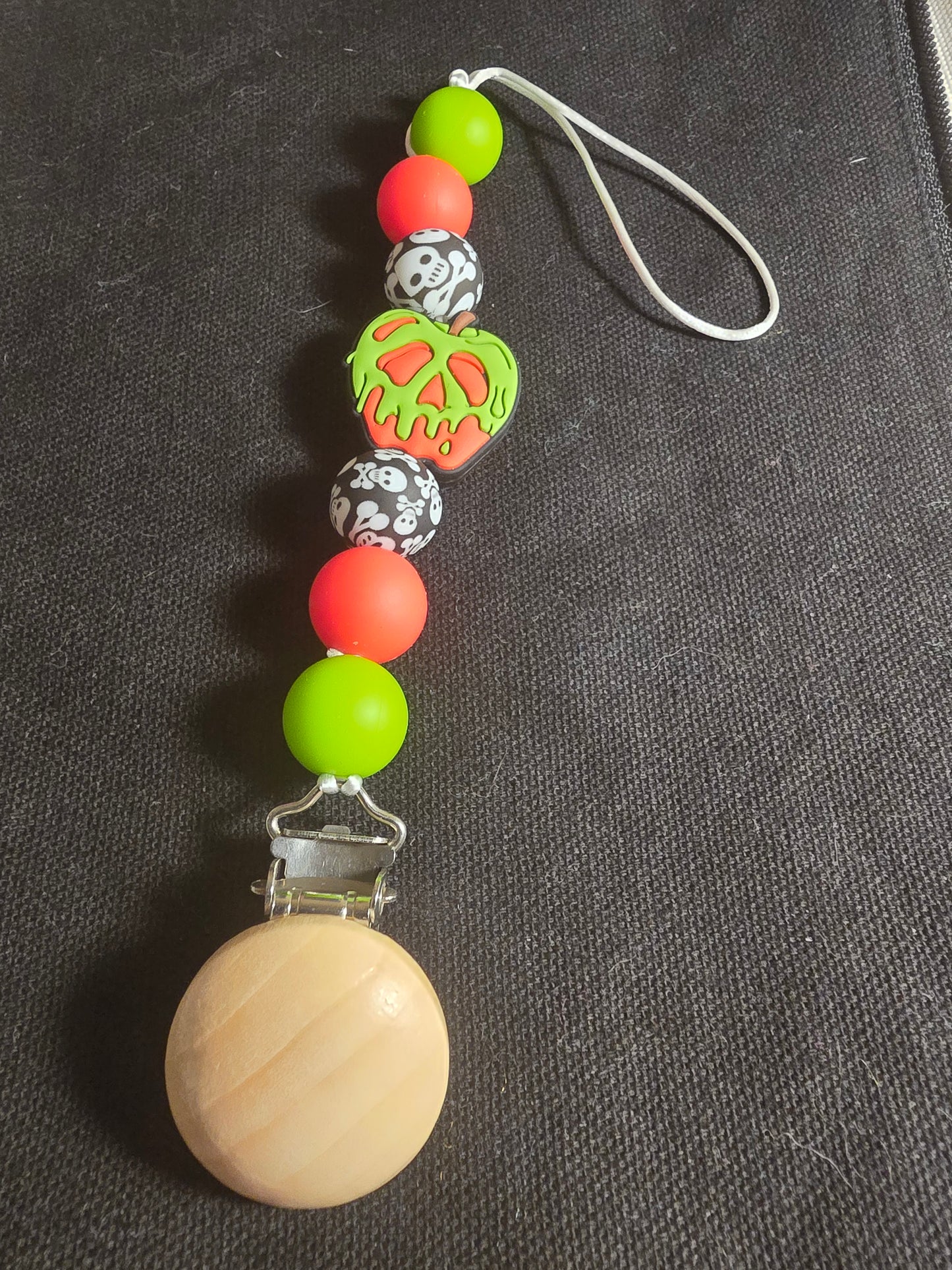 Poison apple pacifier clip