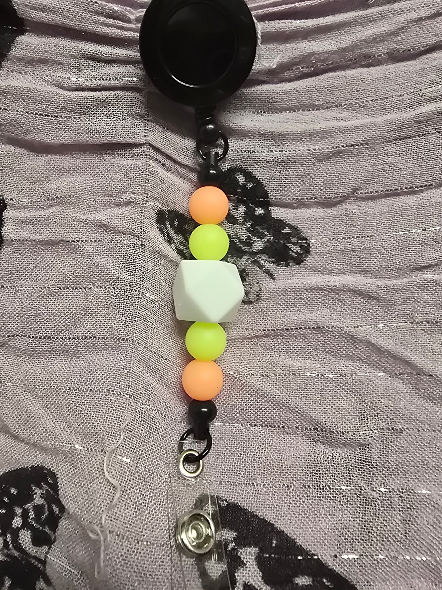 Glow in the dark badge reel
