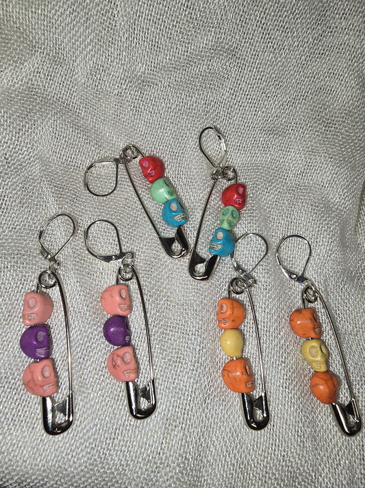 Safety pinned skull earrings