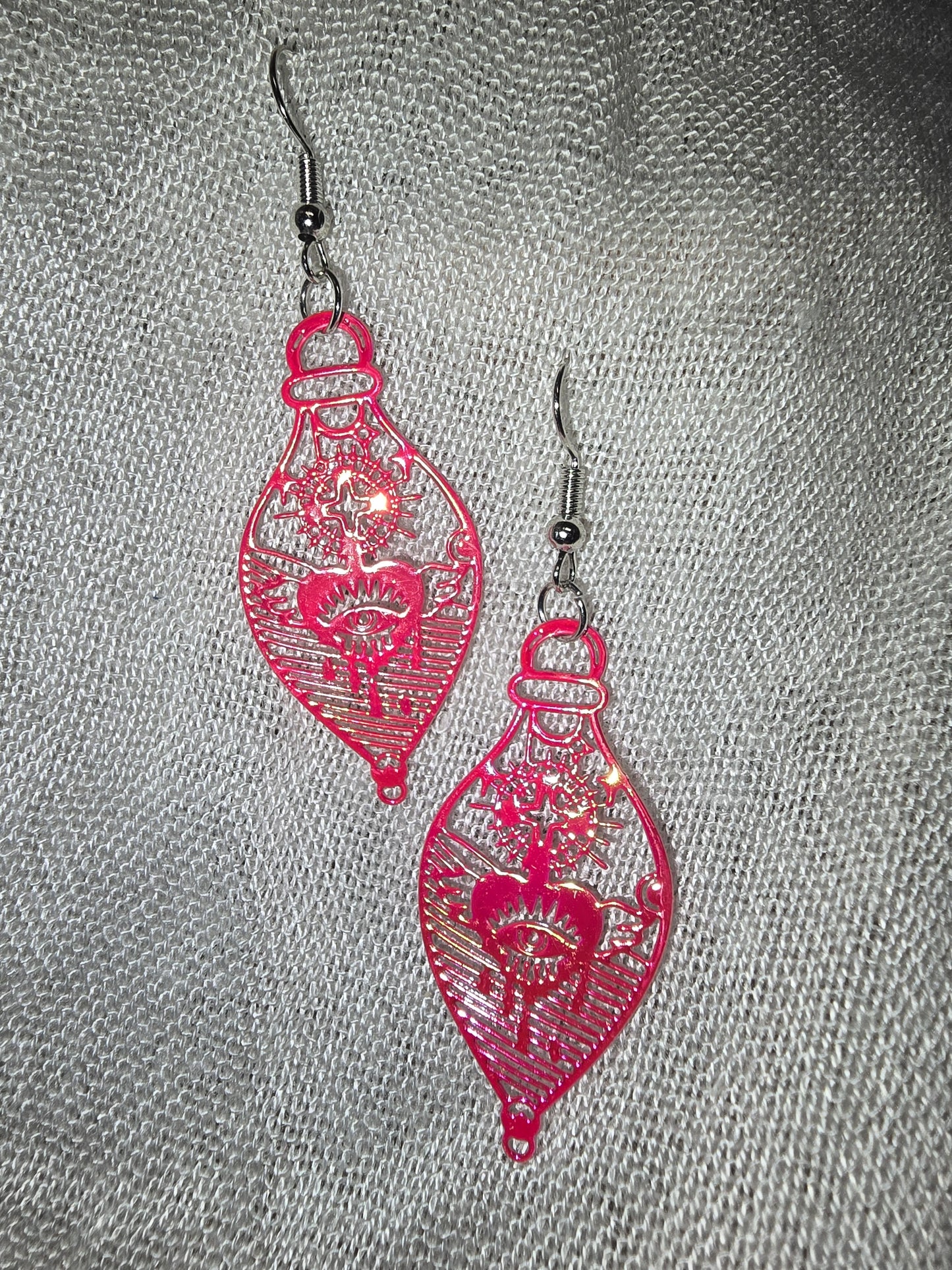 Heart potion earrings
