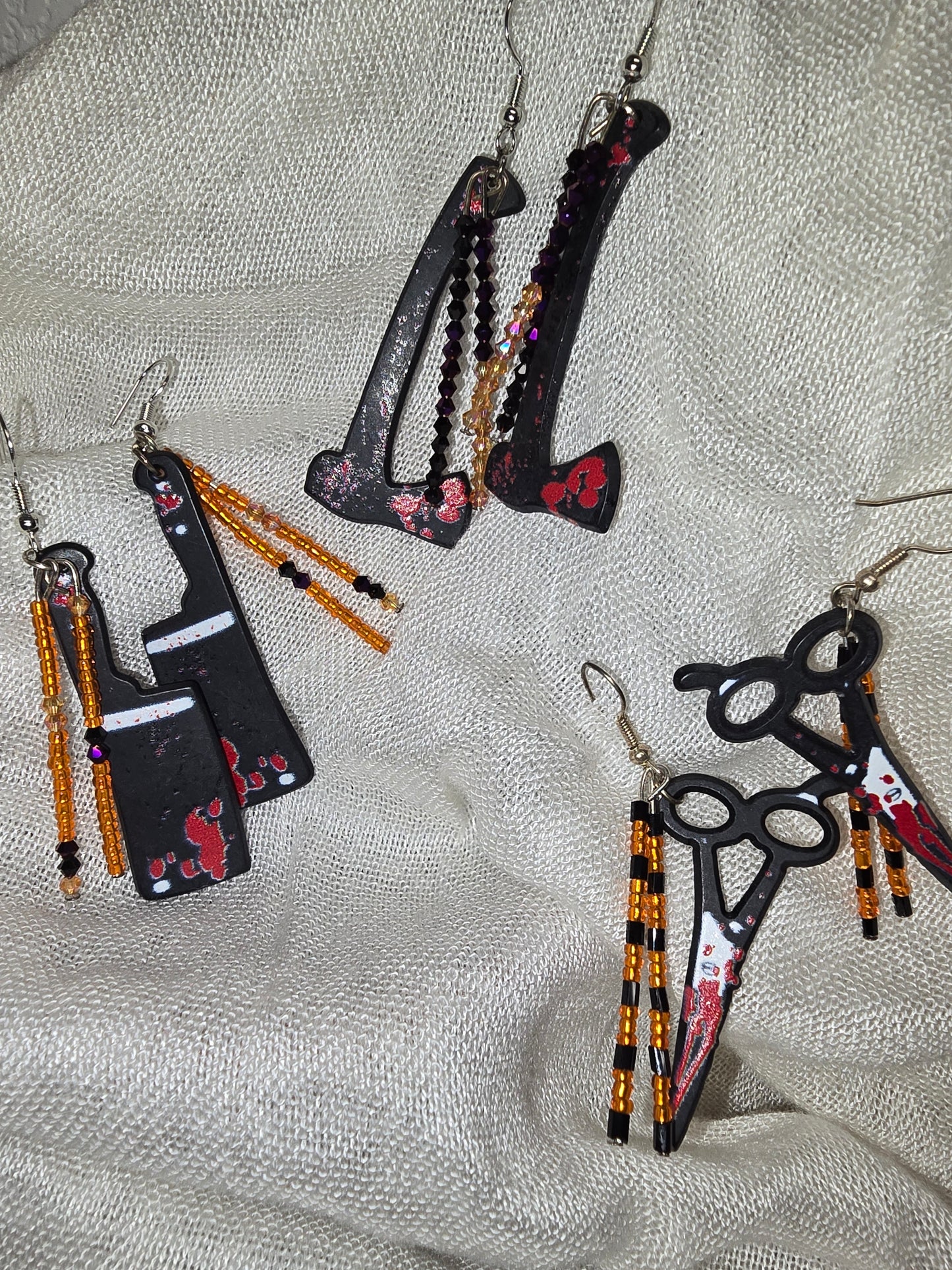 Bloody weapon earrings